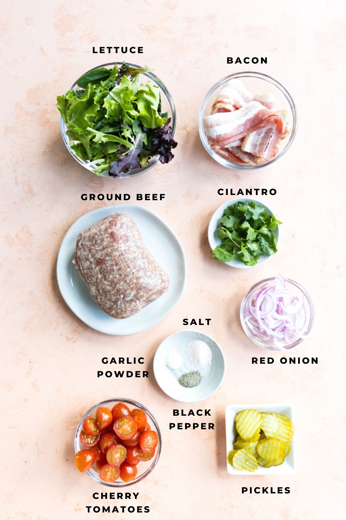 Ingredients for burger bowls measured out into glass cups.