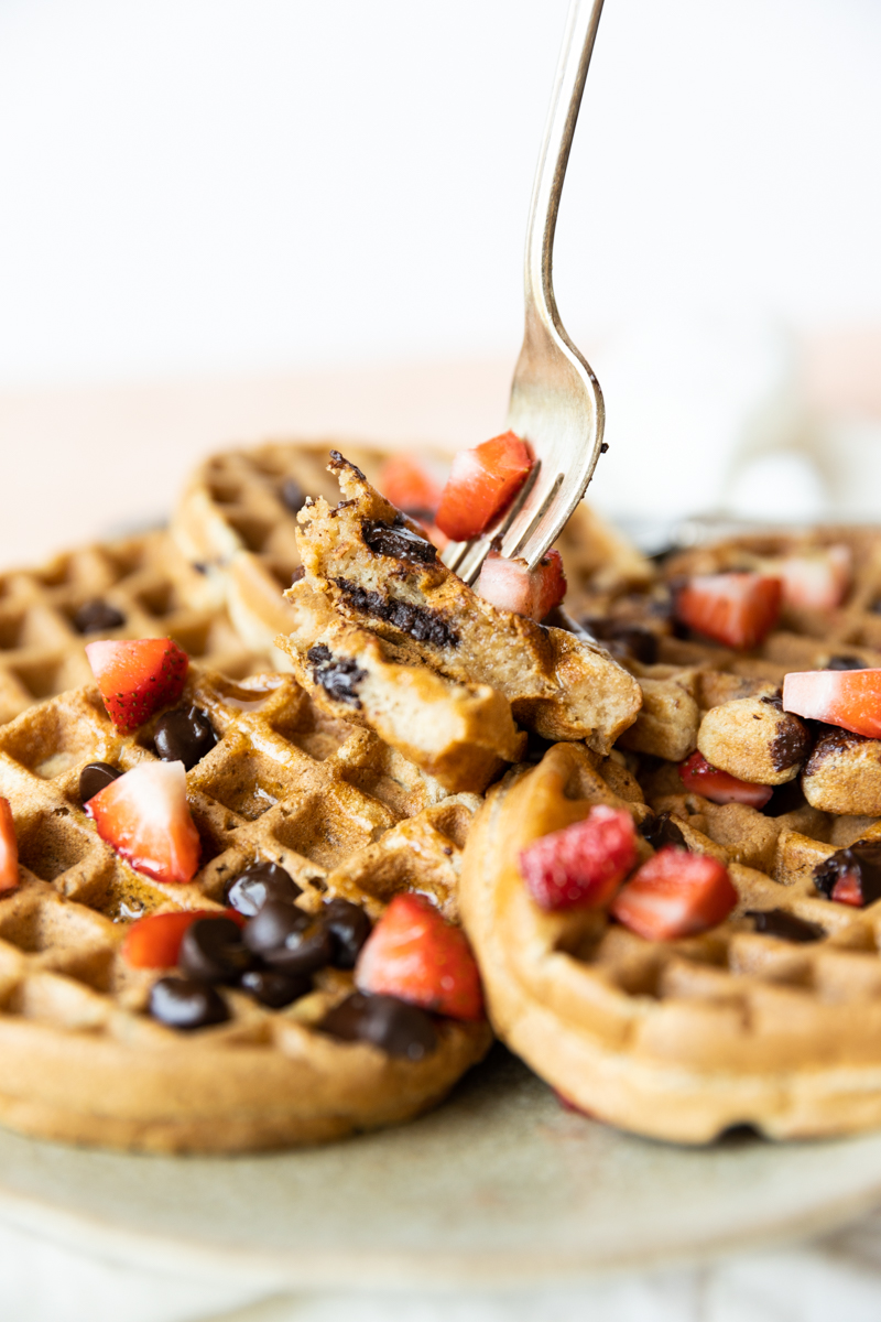 Fork with a big bite of mini waffles.