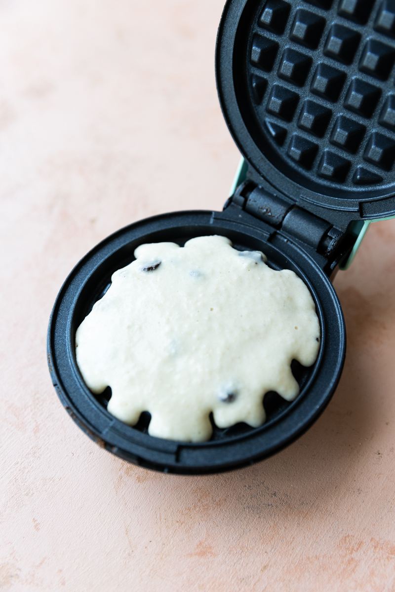 Waffle batter in mini waffle maker.