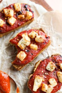 Bite taken out of pizza toast.