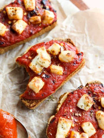 Bite taken out of pizza toast.
