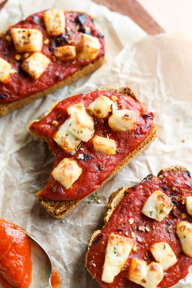 Bite taken out of pizza toast.