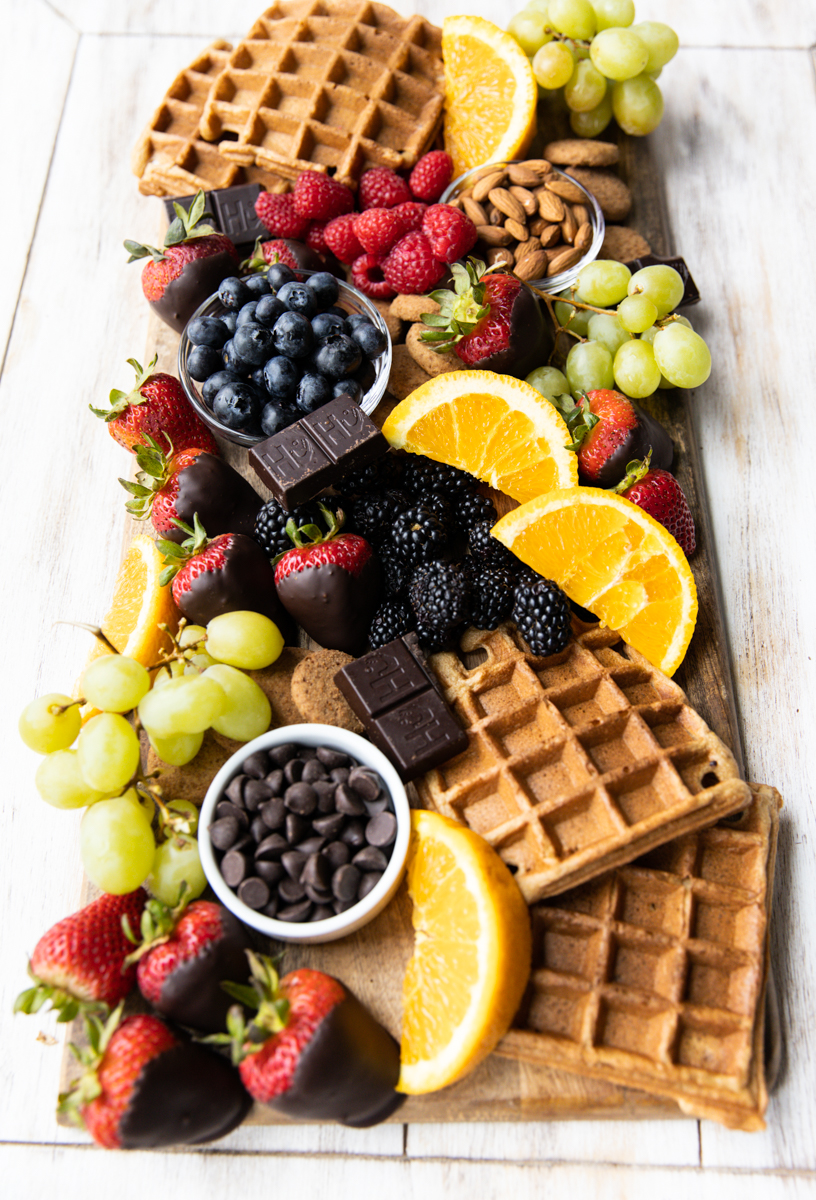 Breakfast charcuterie board with a variety of ingredients.