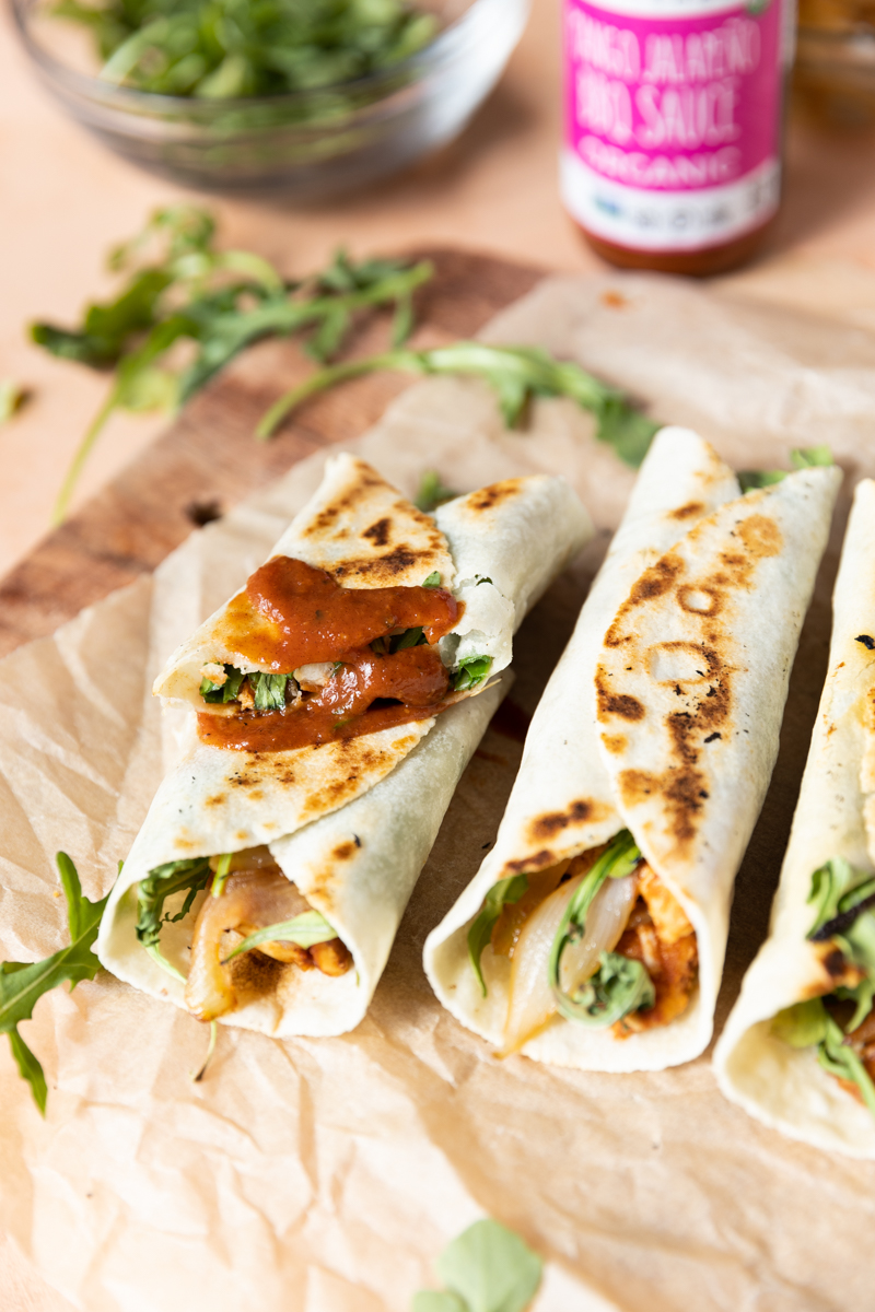 Wrap cut in half and stacked on another wrap.