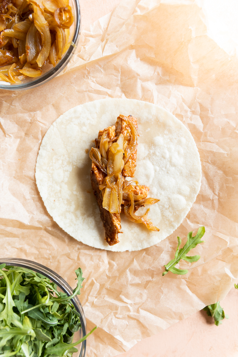 Chicken and onions on grain free wrap.