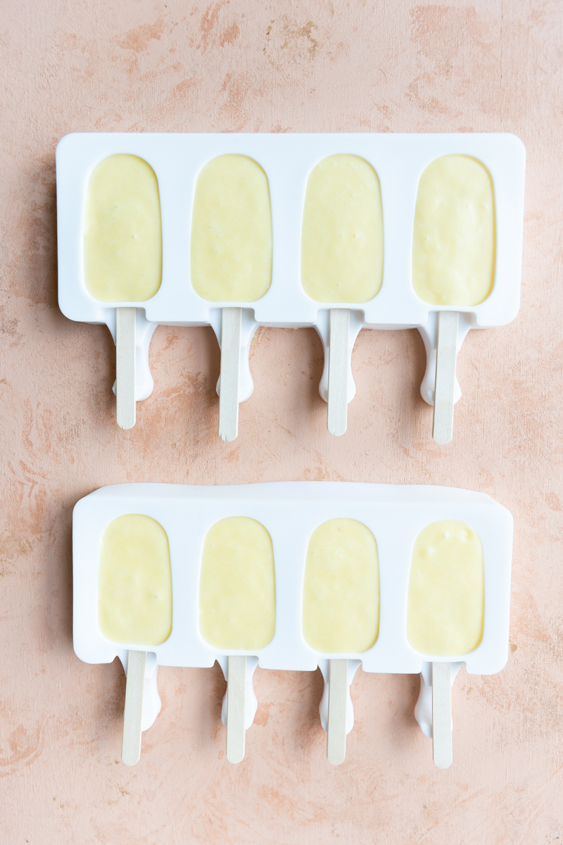 Orange ice cream bars in popsicle molds.