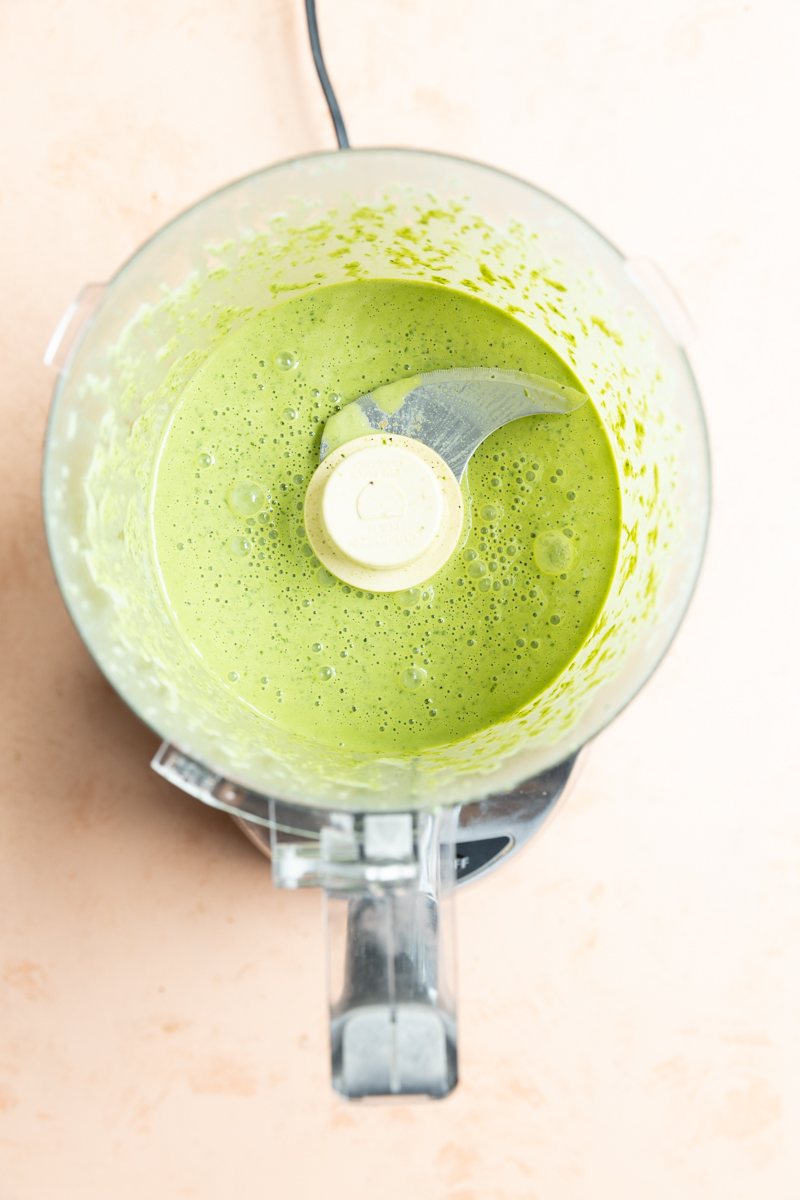 Blended pesto in a food processor.