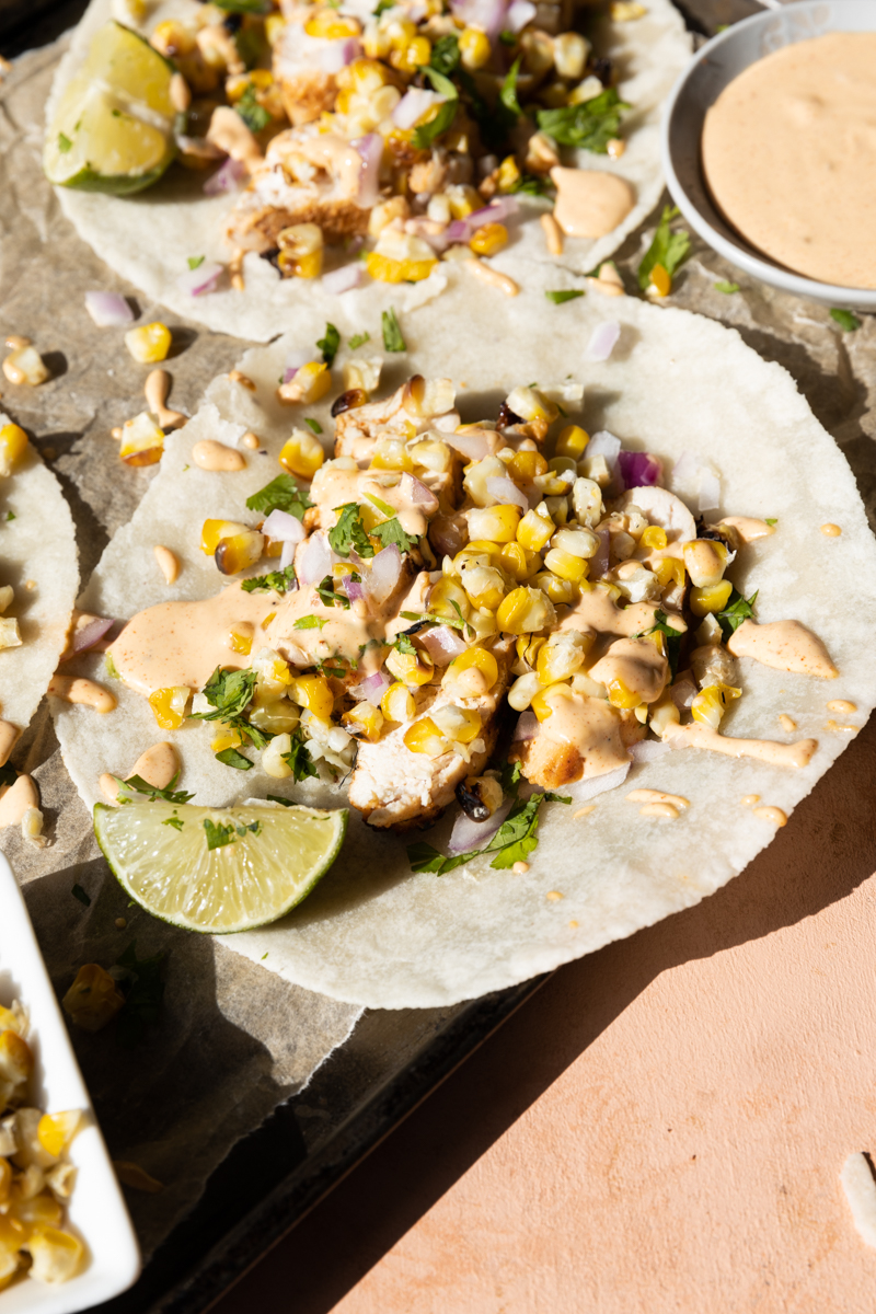 Close up picture of a spicy chicken taco.