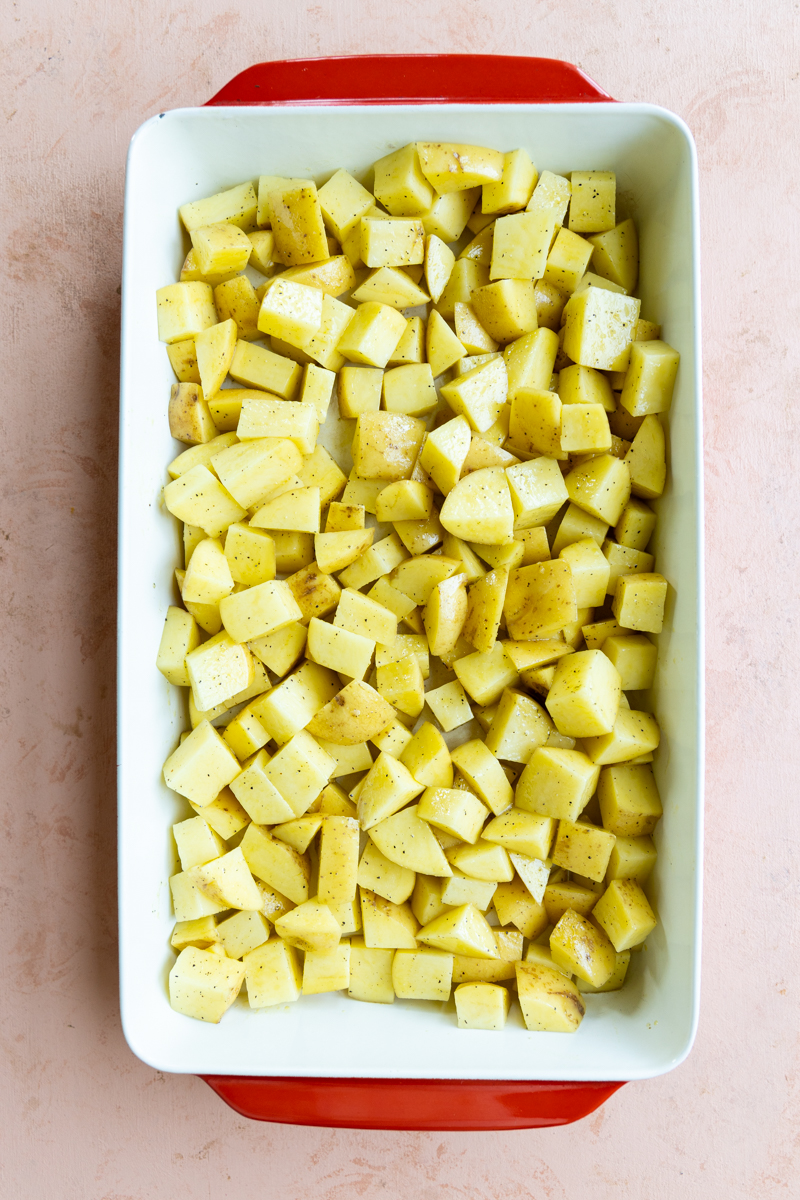 Cubed potatoes in a casserole dish.