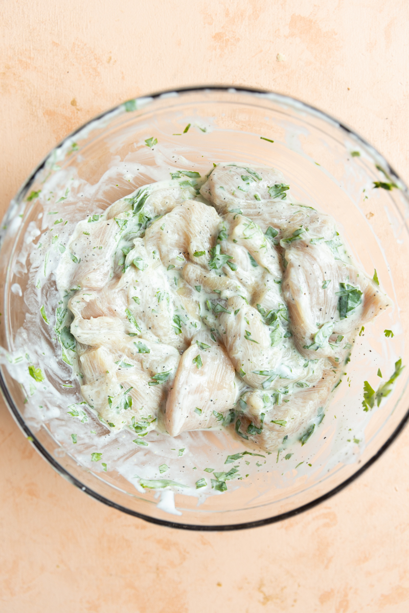 Chicken breast marinating in homemade yogurt mix.
