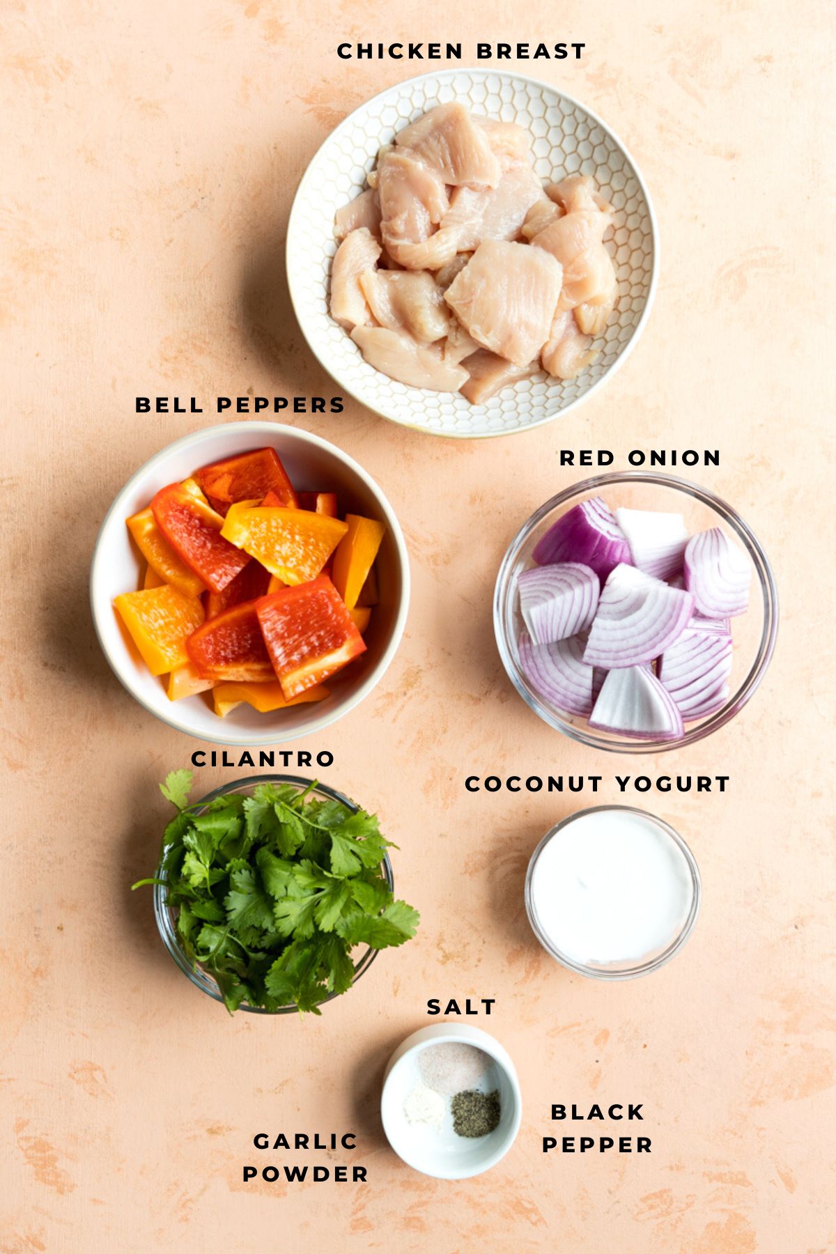 Chicken breast, coconut yogurt, peppers, red onion, cilantro, salt and black pepper measured into cups.