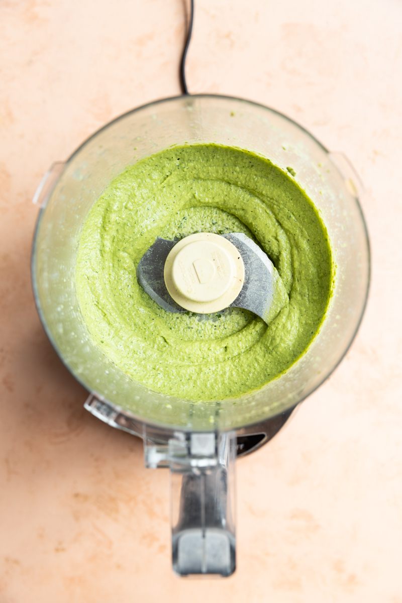 Creamy cashew pesto in a food processor.