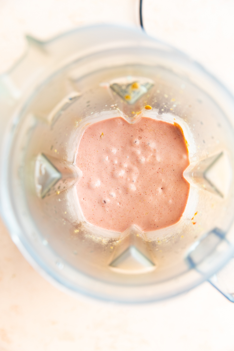 Blended strawberry banana smoothie in blender.