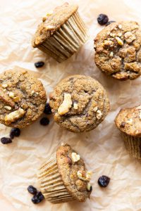 Cranberry Walnut Muffins on parchment paper.