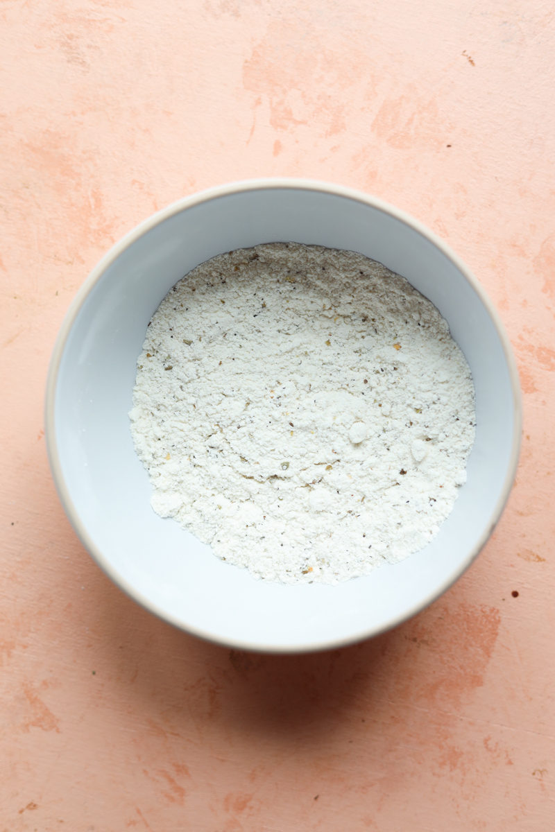 Breadcrumb dry mixture in a white bowl.