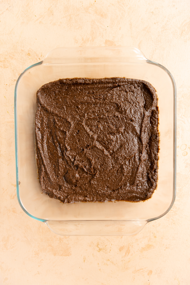 Brownie batter in greased 8x8 baking dish.