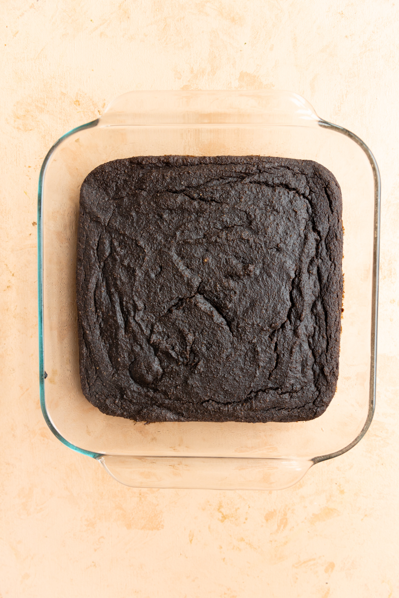 Baked brownies in 8x8 glass baking dish.