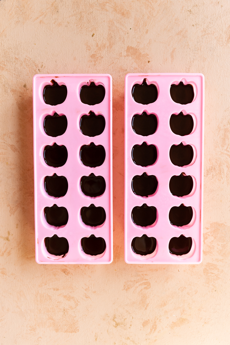 Pumpkin candy in pink silcone molds.