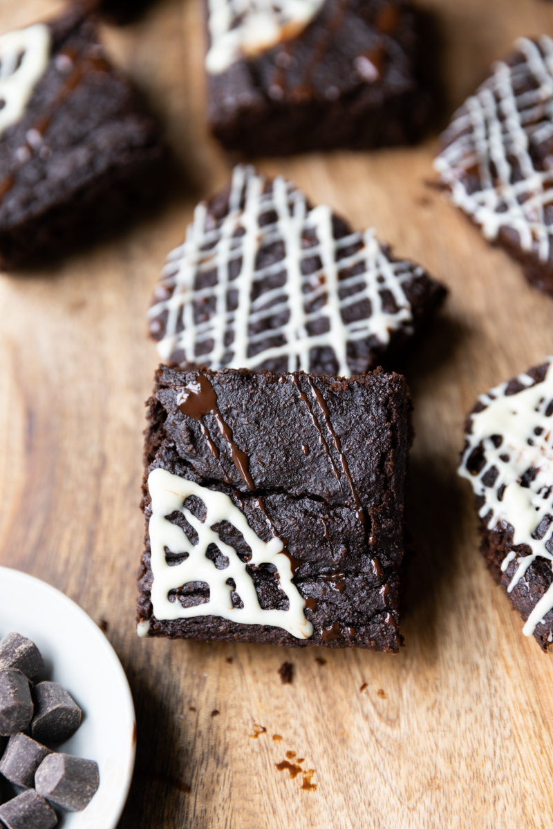 Halloween brownies with a white chocolate spider web.