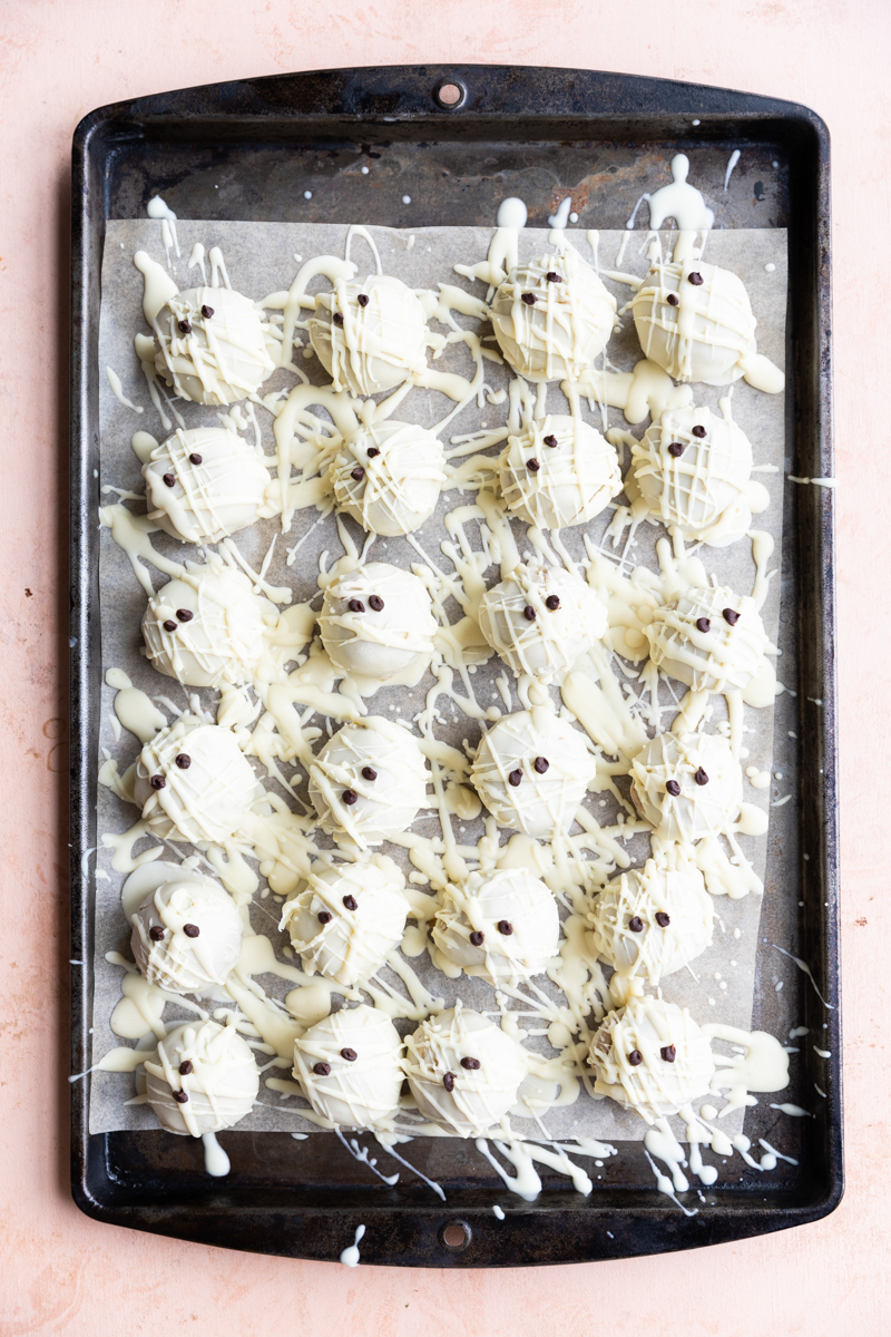 White chocolate dipped cake pops with little chocolate eyes.