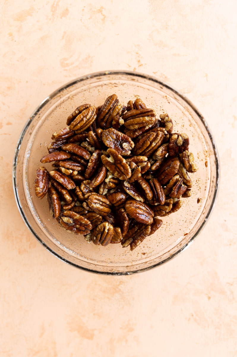 Candied pecans in mixing bowl.