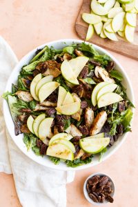 Large green apples salad in white bowl.