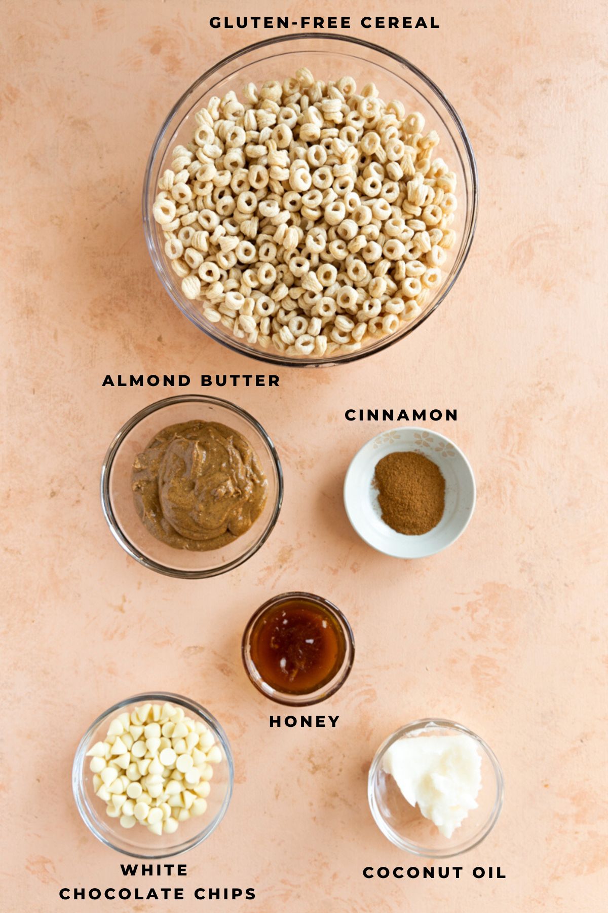 Cereal cookie ingredients measured out in small bowls.