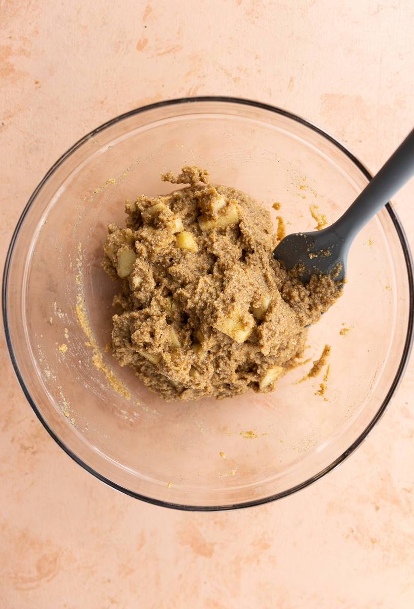 Muffin batter with apple chunks.