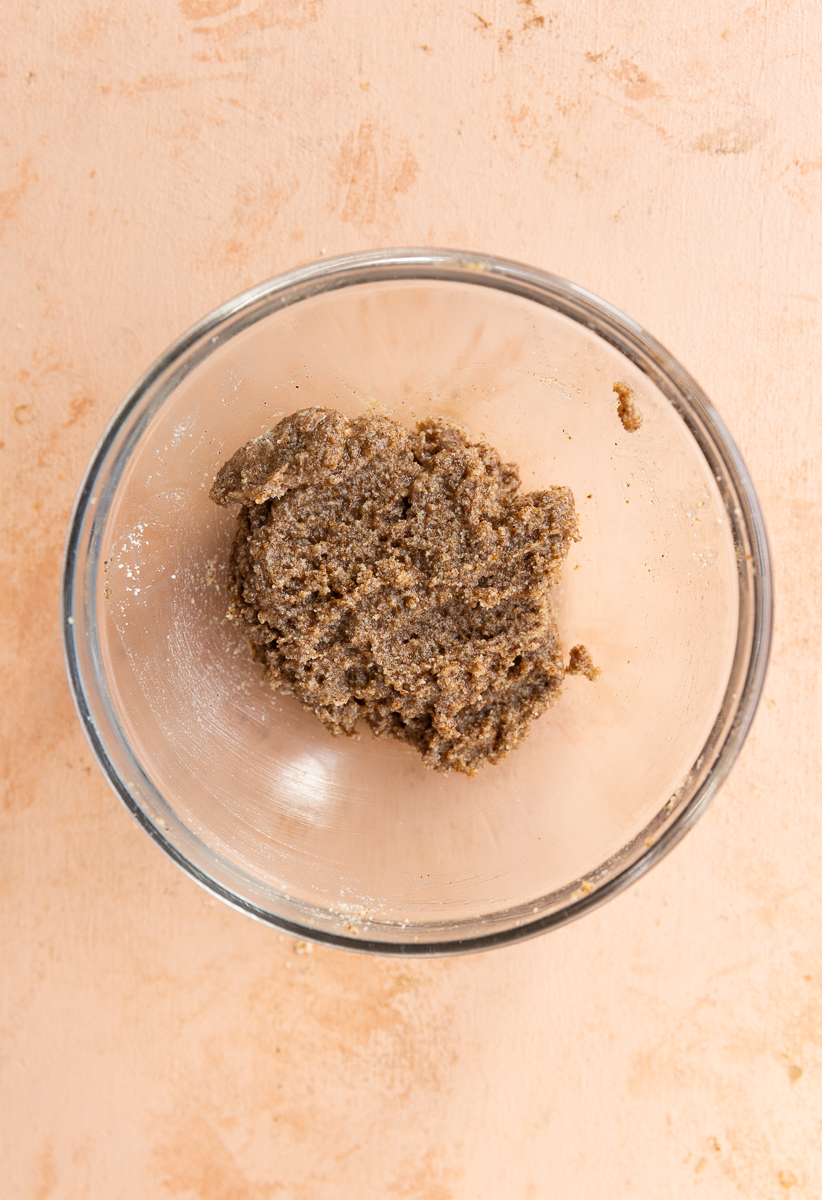 Crumble topping in small glass bowl.