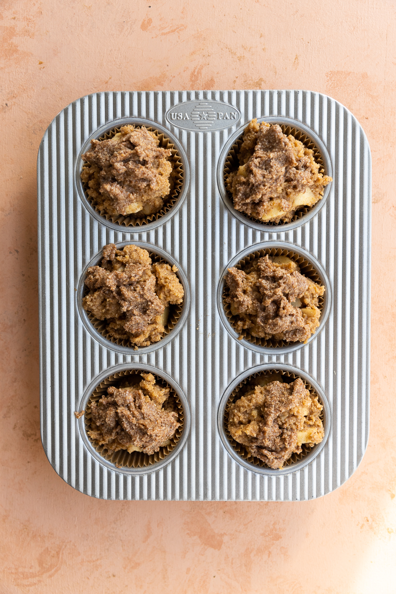 Apple muffins in muffin tin.