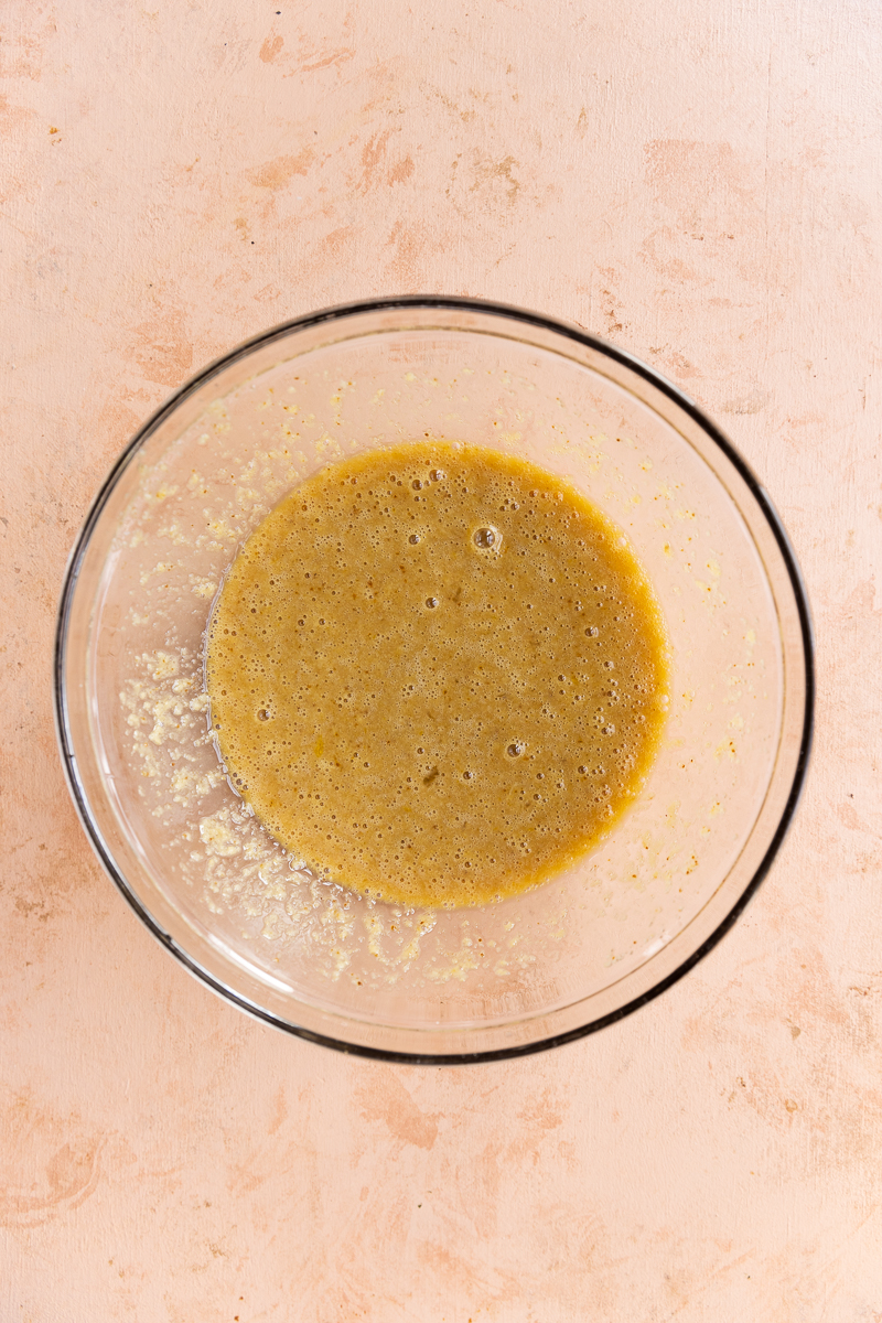 Wet ingredients in glass mixing bowl.