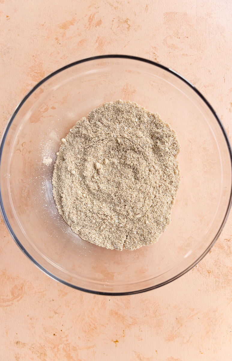 Dry ingredients in glass mixing bowl.
