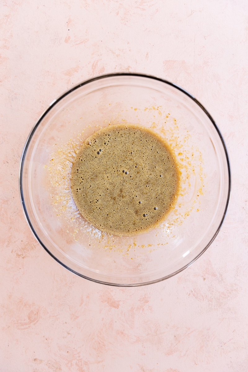 Wet ingredients in a glass mixing bowl.