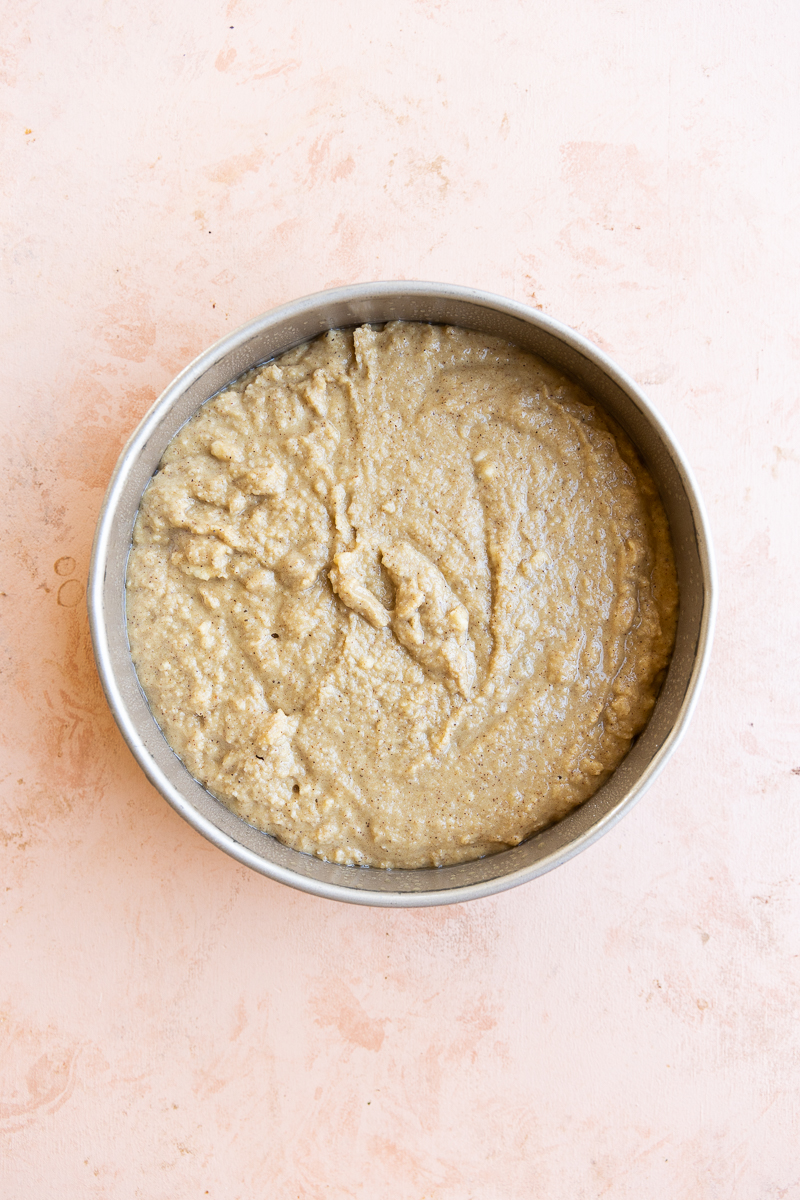 Banana cake batter in greased 9x9 round cake pan.