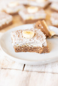 Banana cream pie bar on a white plate.