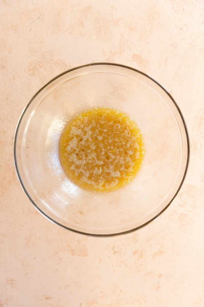 Wet ingredients in glass mixing bowl.