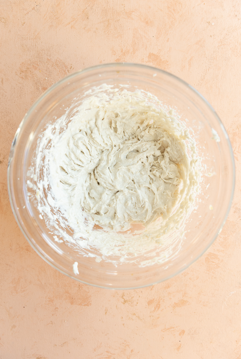 Coconut whipped cream in mixing bowl.