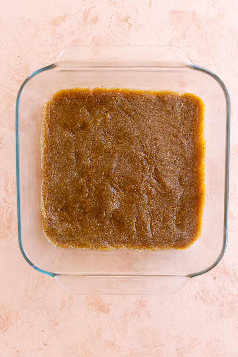 Pumpkin pie crust pressed into baking pan.