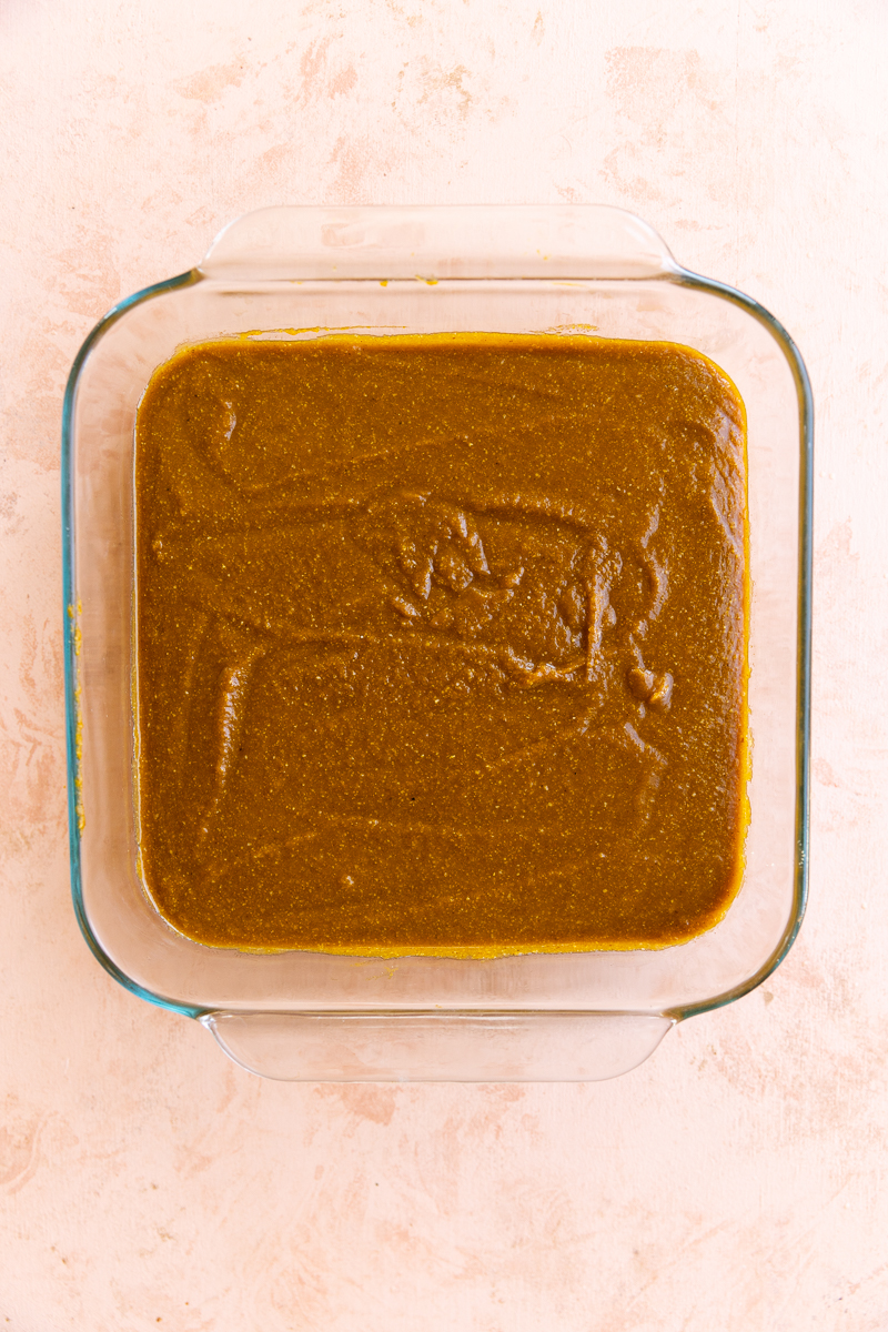 Pumpkin pie filling in square baking dish.