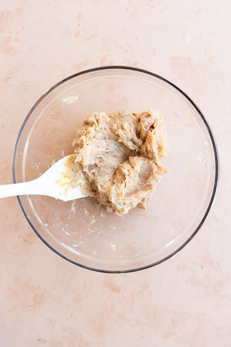 Meatball mixture in glass bowl.