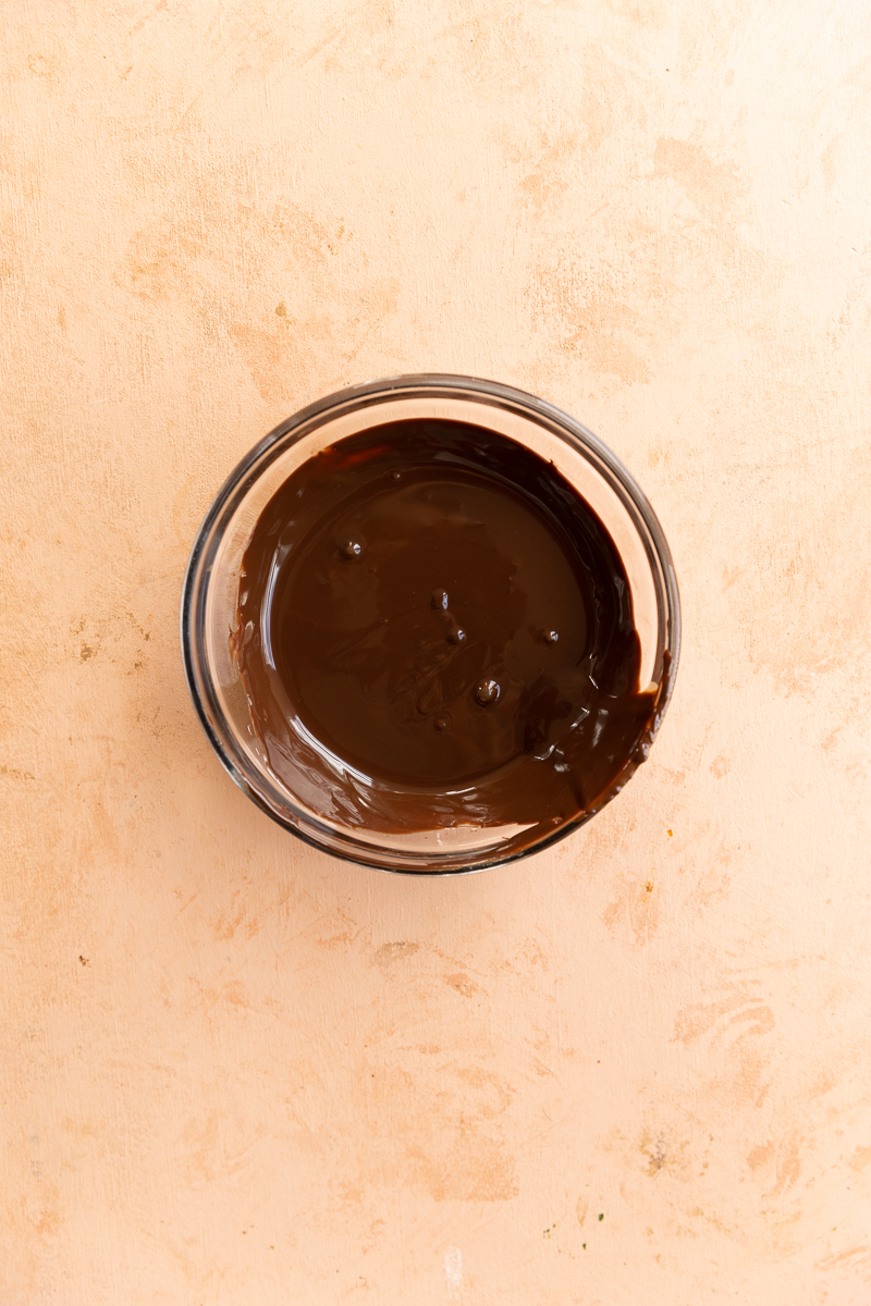 Melted chocolate in small mixing bowl.