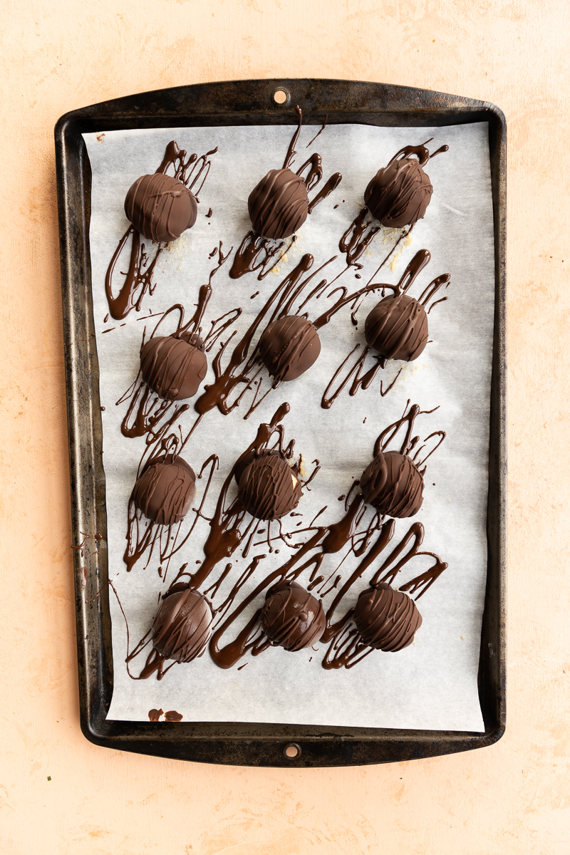 Cookie dough truffles drizzled with extra chocolate.