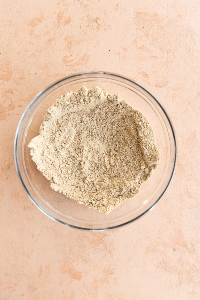 Dry ingredients in a glass mixing bowl.