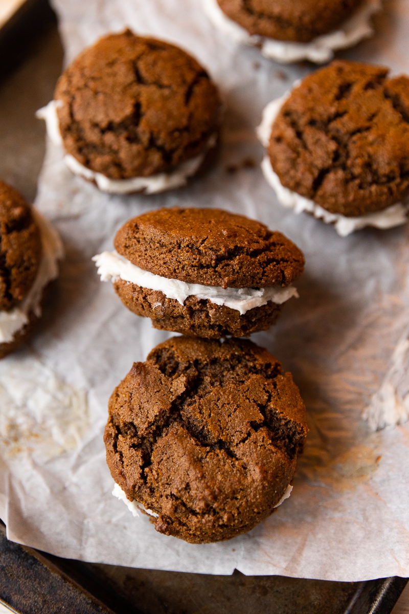 Gingerbread cookie sandwiches with vanilla frosting.
