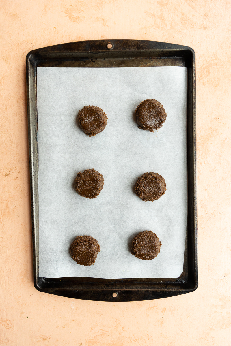 Cookies on parchment paper lined baking sheet.