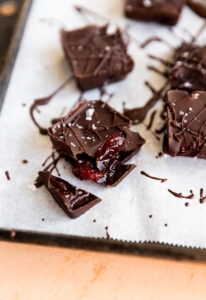 Chocolate cherry cup broken in half.