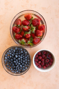 Fruit soaking in glass bowls.