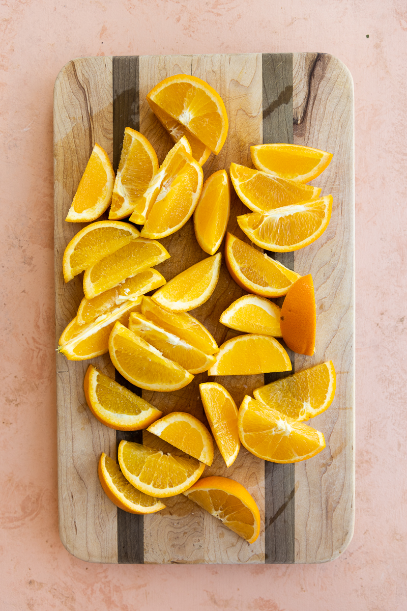 Cutting board with orange slices.