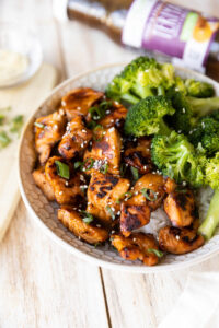 Air fried teriyaki salmon in a bowl with broccoli.