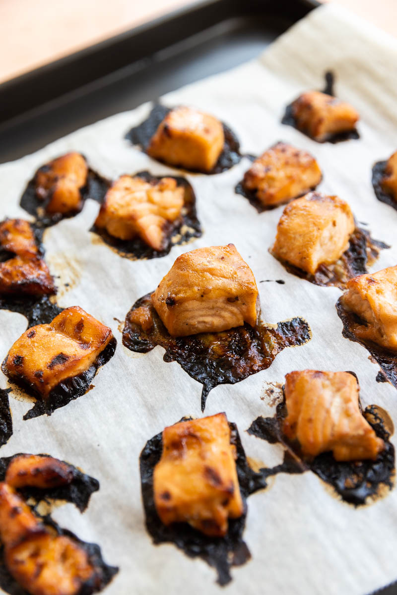 Crispy salmon on a baking tray.